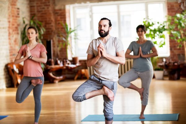 group-of-people-doing-yoga-tree-pose-at-studio-2021-08-26-22-49-26-utc.jpg